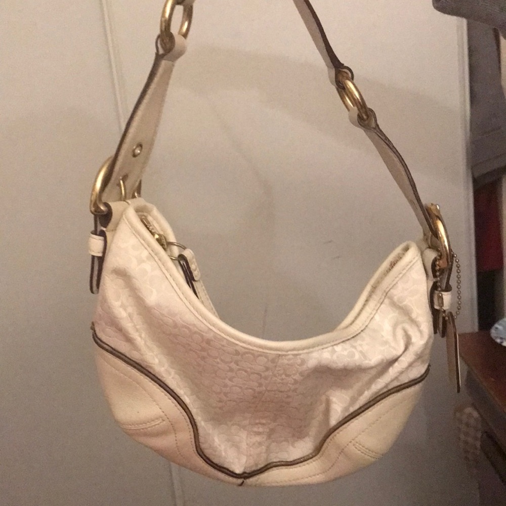 White and gold coach purse